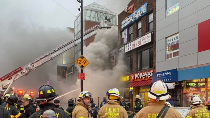 A large fire tore through a Flushing mall early Thursday that houses 30 kiosks (Photo FDNY)