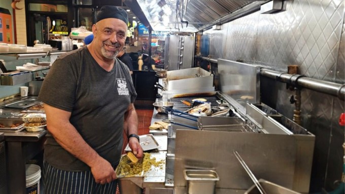 Freddy Zeideia pictured Thursday preparing his popular Falafels (Photo by Michael Dorgan, Queens Post)