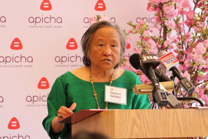 Apicha Center CEO Therese Rodriquez speaking at the opening (Photo by Michael Dorgan)