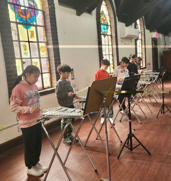 Sunnyside Drum Corp practice in All Saints Church. Credit: Tony Lana