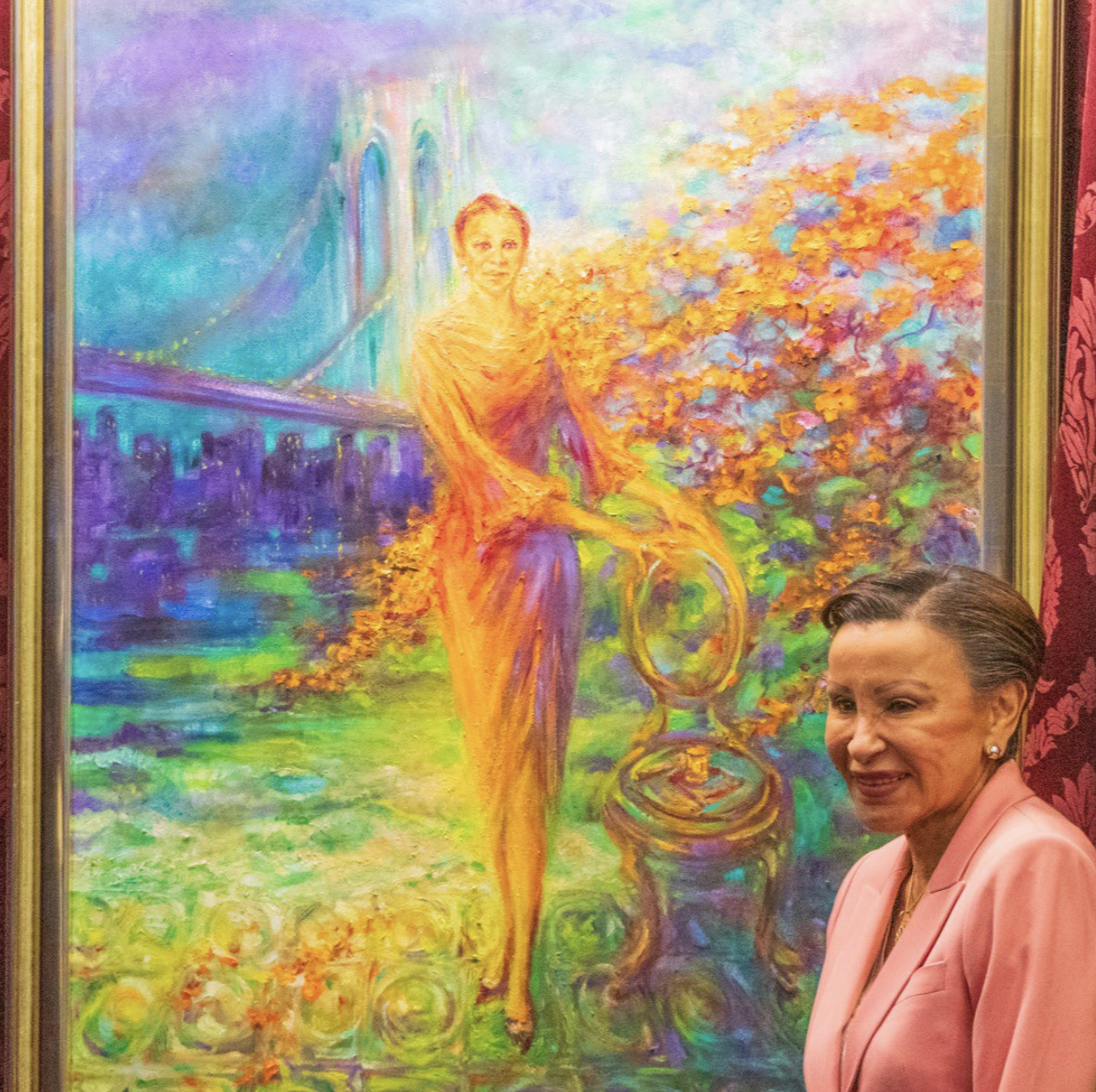 U.S Rep. Nydia Velázquez in front of her colorful portrait