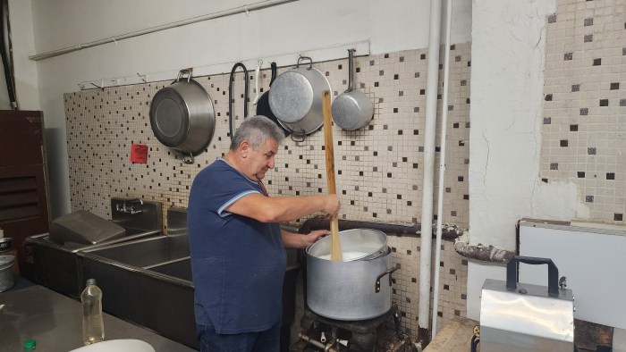 Ciccarelli making fresh cheese. Photo Shane O'Brien