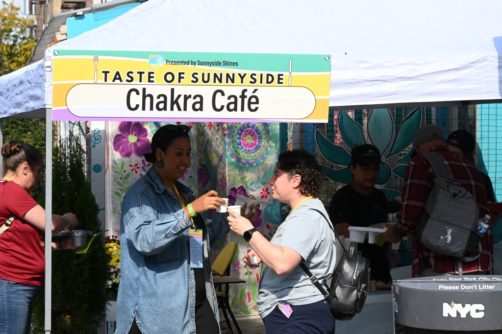 Attendees sample food at Chakra Cafe during the 2024 Taste of Sunnyside. Photo: Ramy Mahmoud.