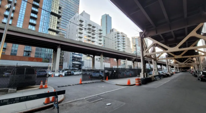 The area under the ramps will be transformed into open space. Dutch Kills Street (R) and the adjacent area (lL) that is being used by the NYPD (Photo: Michael Dorgan, Queens Post)