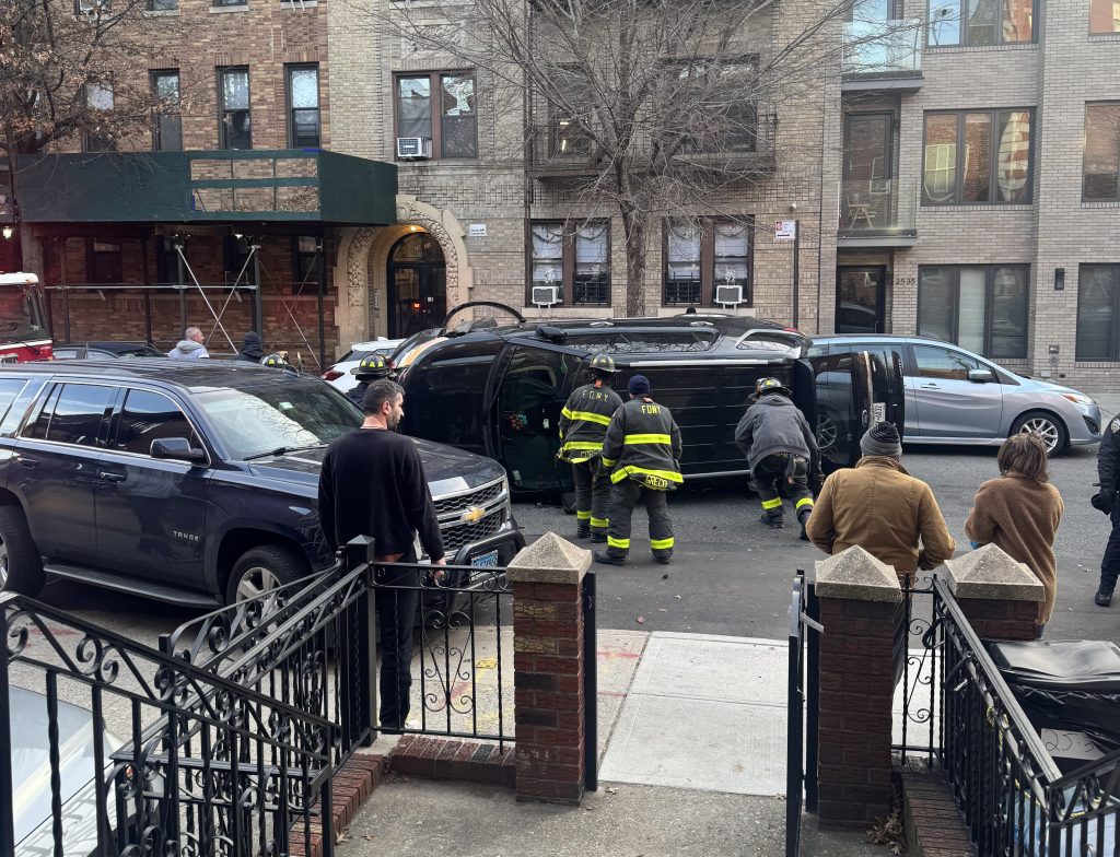 Photo of a flipped car on 38th Street near Astoria Boulevard on Sunday, Dec. 15. Photo: kaffeinatedunicorn Reddit