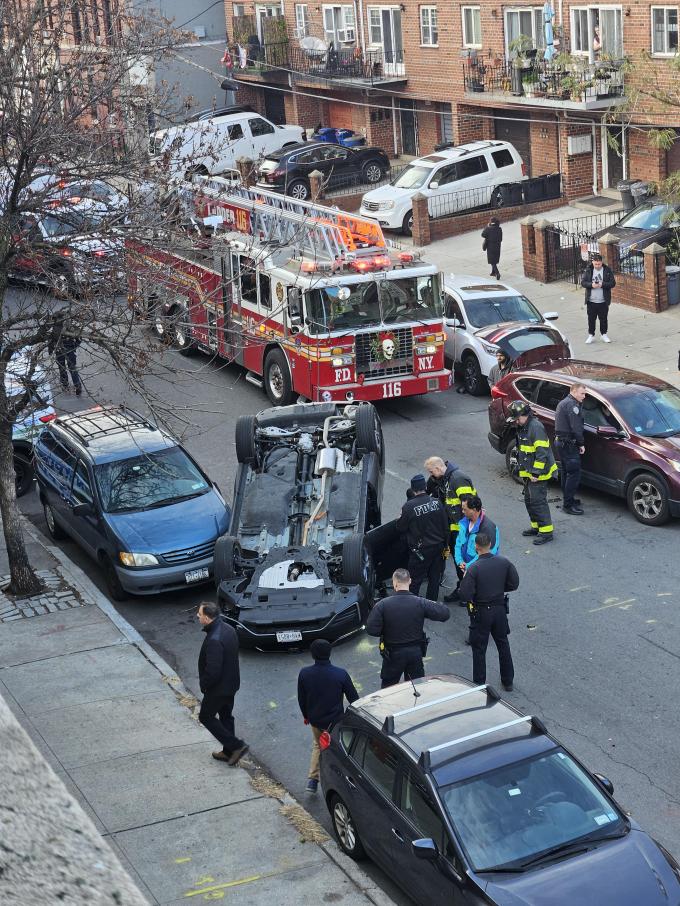 FDNY responds to an overturned car on 33rd Street on Monday morning. Photo: Greedy-Boot-1583 Reddit