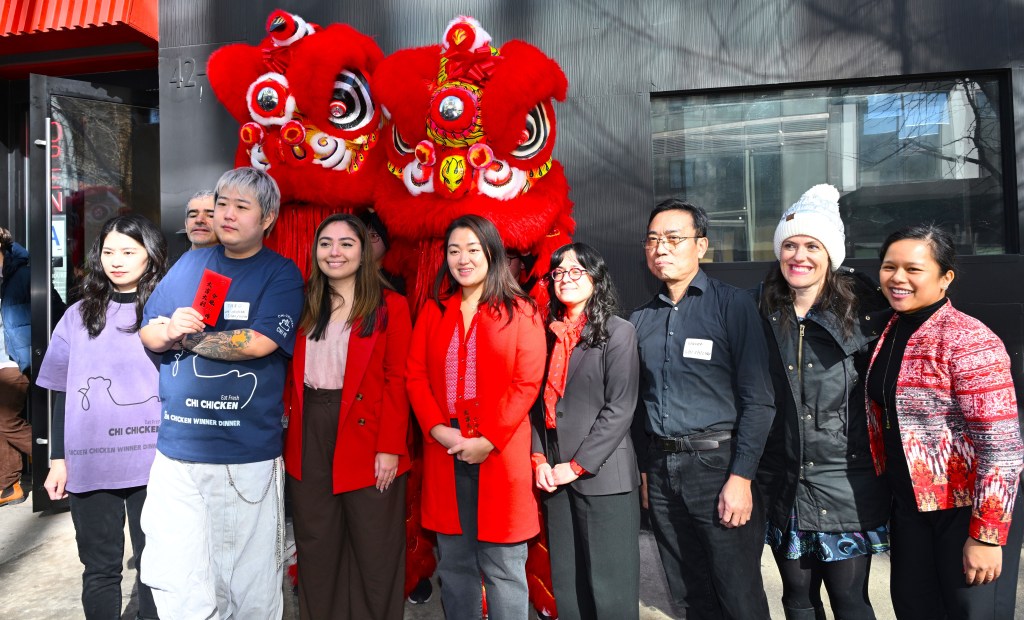 Elected officials, LICP representatives and Chi Chicken owner Taro Yang (second from left) pose with ceremonial lions at launch of LIC Lunar New Year. Photo Ramy Mahmoud