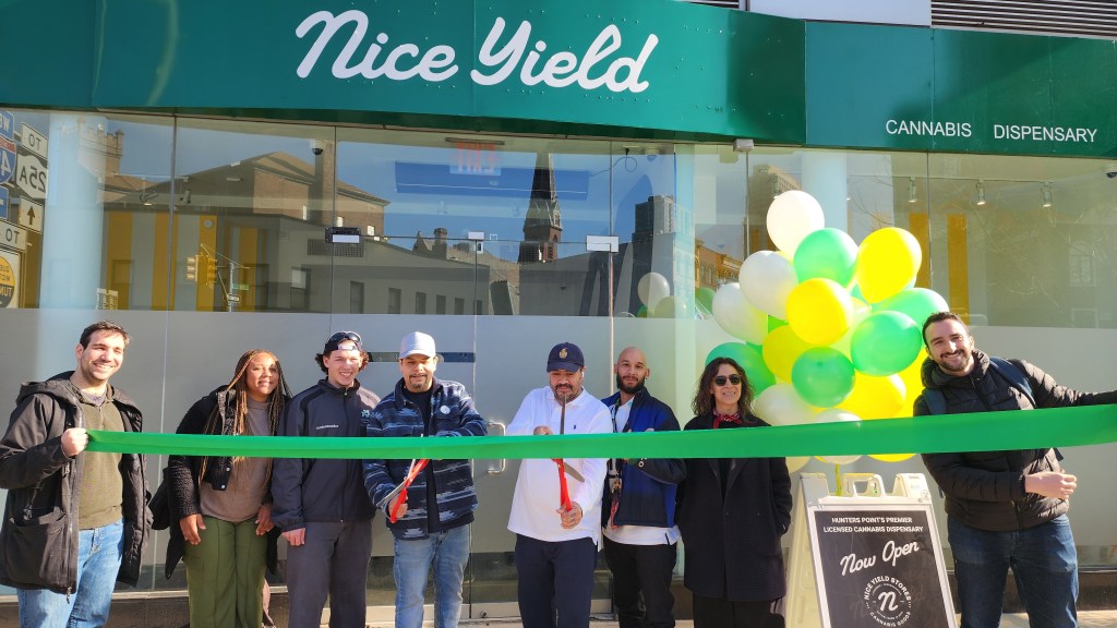 Steve Urbano cuts the ribbon at the grand opening of Nice Yield on Jackson Avenue. Photo: Shane O'Brien.