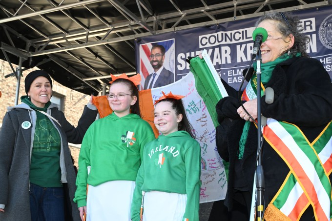 Members of the Rainbow Twirlers present St. Pat's for All with a signed Irish flag. Photo: Ramy Mahmoud